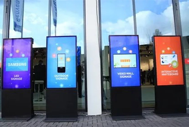 Multiple digital signage screens, highlighting 'Retail Vue' advertising display technology